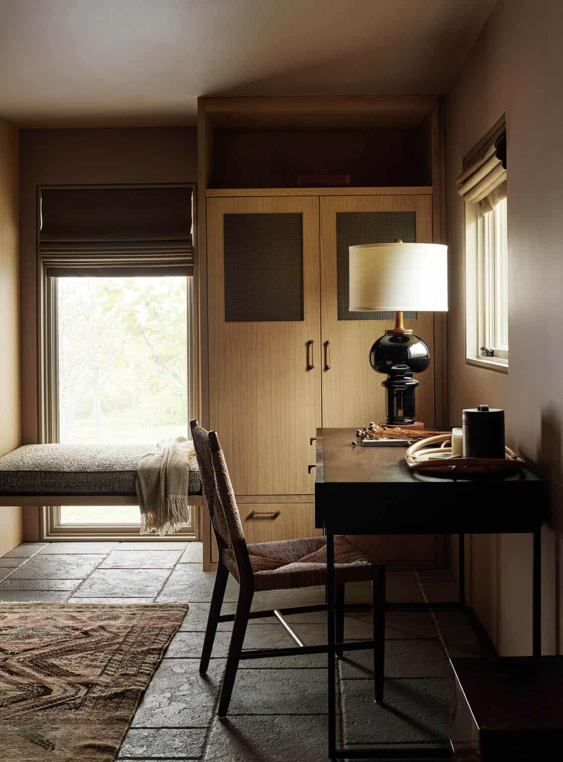 Study nook with a window bench, oak wardrobe with mesh panels and a desk with woven chair