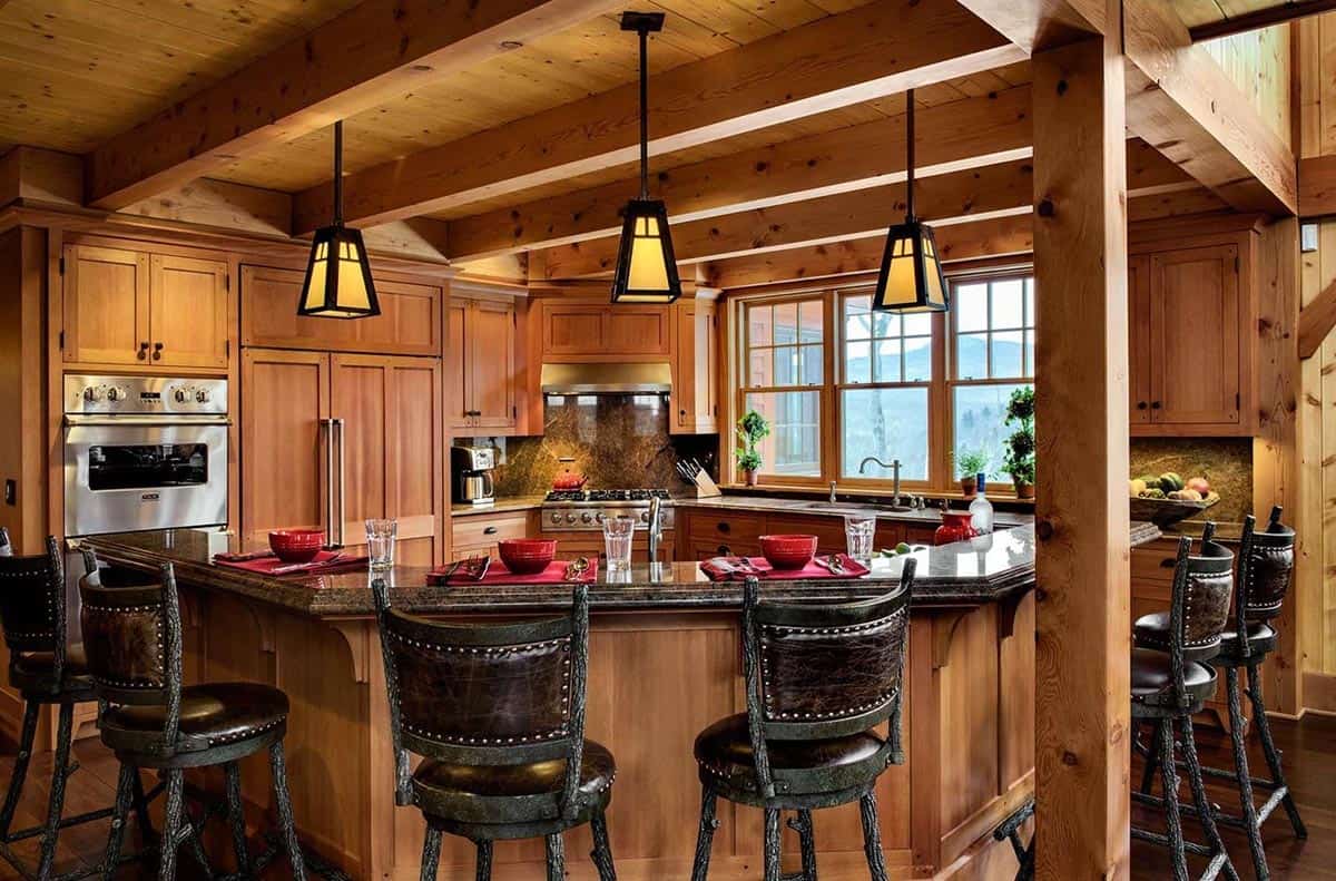 Kitchen peninsula with twig-style leather bar stools, mica pendant lights and windows with mountain views