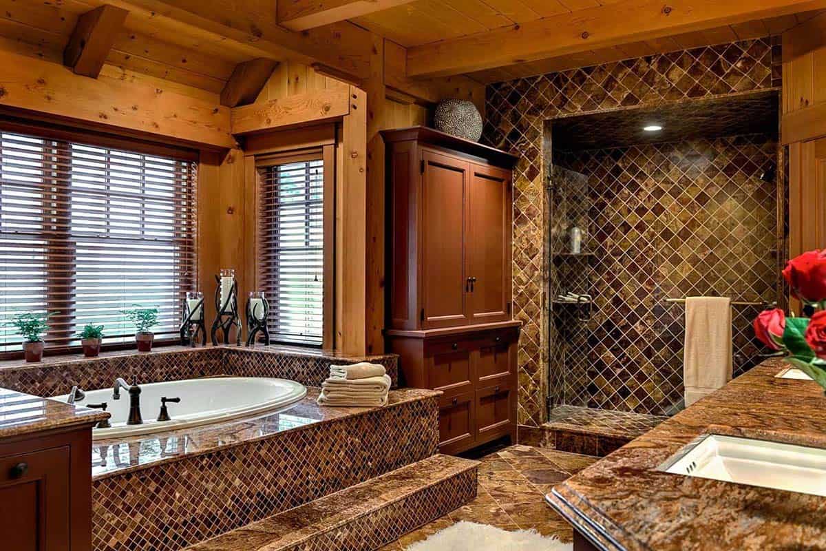 Bathroom with a mosaic-tiled tub platform, stone-tiled walk-in shower and granite countertop