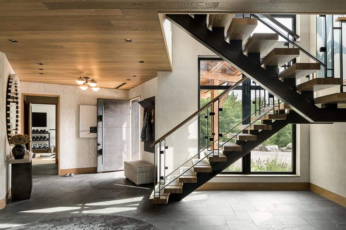 Slate-floored foyer with floating oak and steel staircase