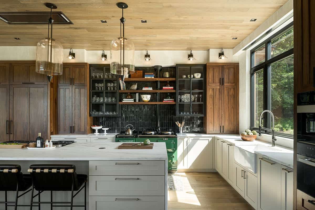 Kitchen with walnut cabinetry, green AGA range, and farmhouse sink