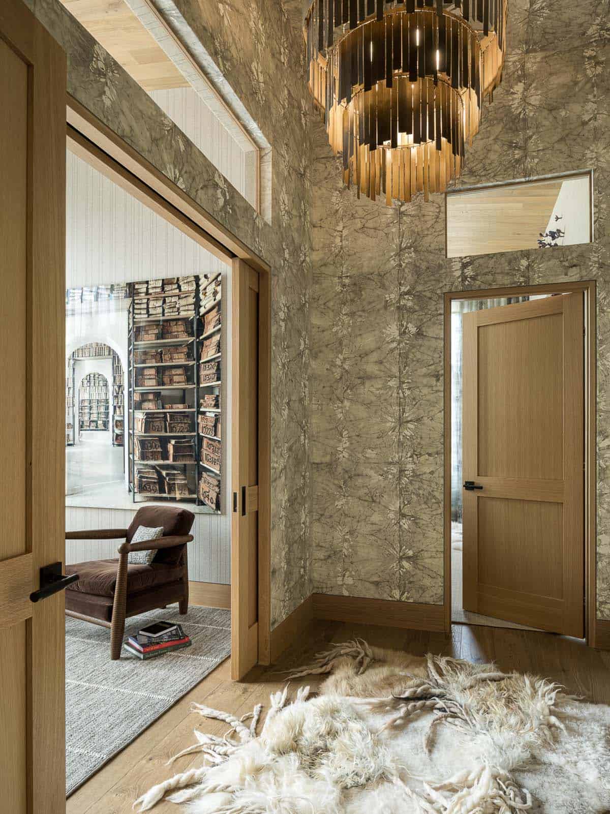 Hallway with tie-dye wallpaper and wood fringe chandelier
