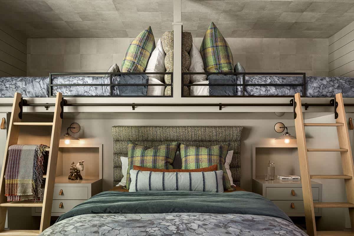 Bunk room with lofted beds, oak ladders, and plaid pillows
