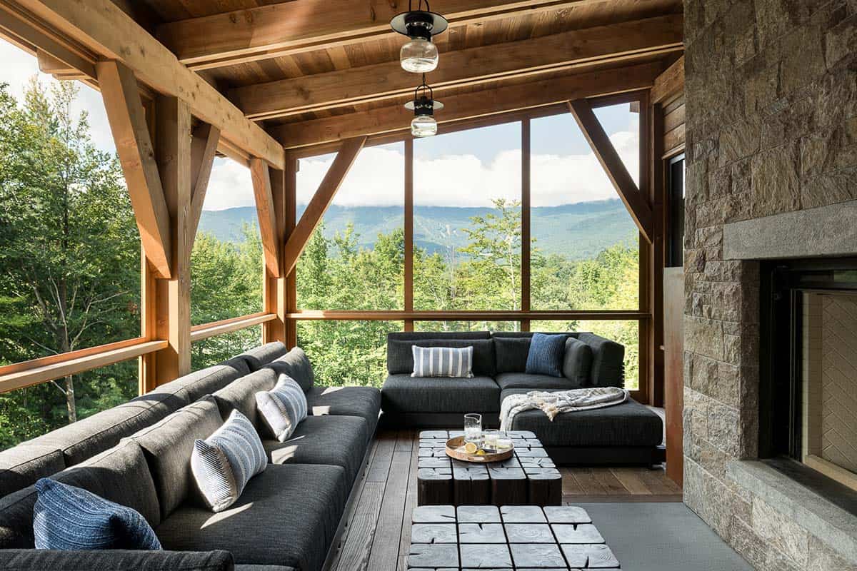 Screened porch with sectional seating, fireplace, and mountain views