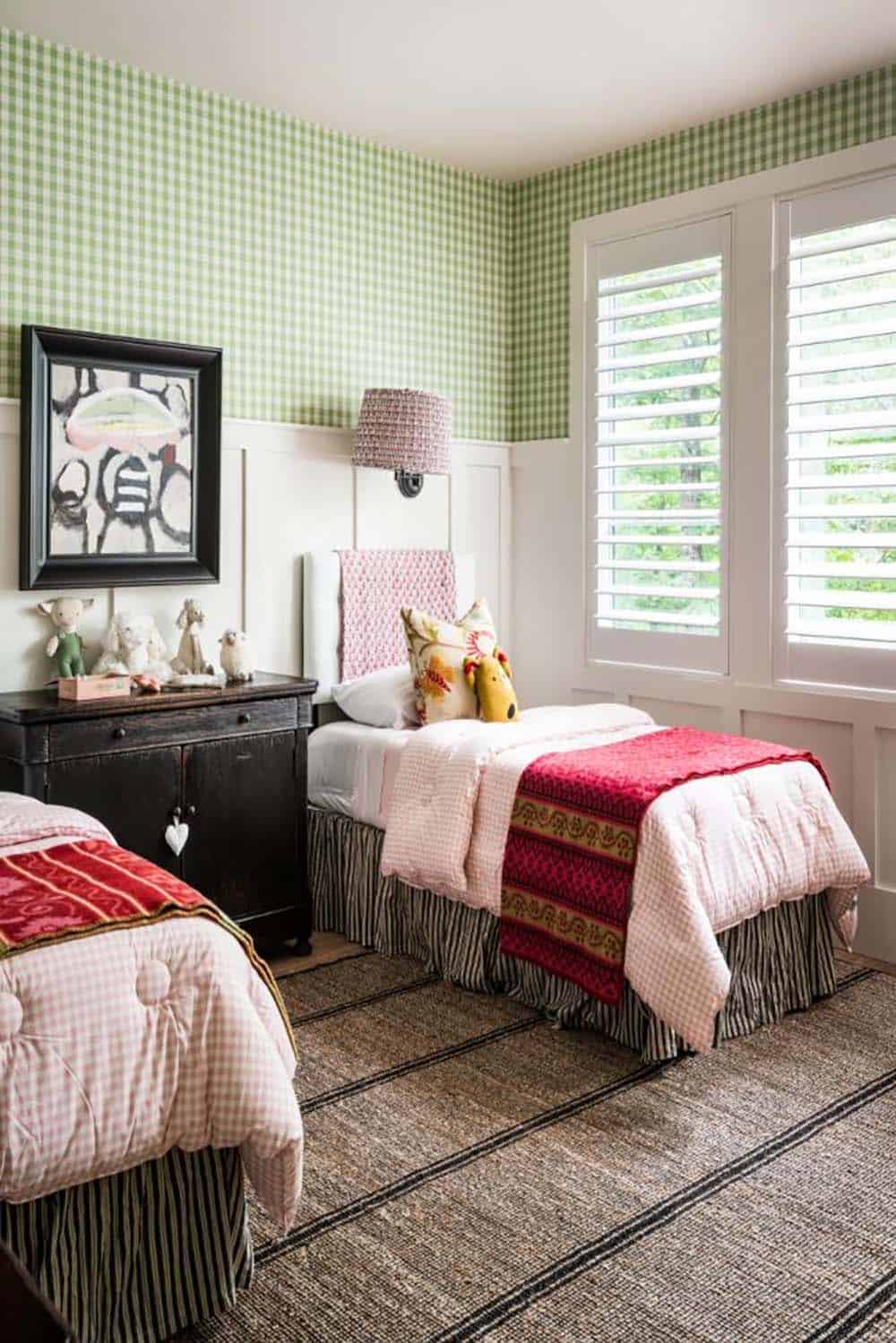 Twin bed with pink gingham comforter beside green gingham wallpaper
