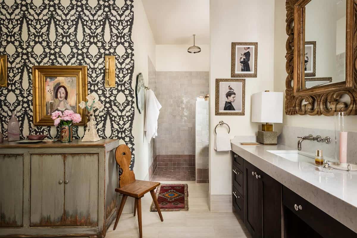 Primary bathroom with black and cream wallpaper and zellige tile shower