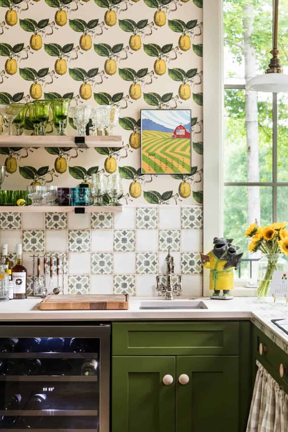 Bar with lemon wallpaper, green cabinets, patterned tile and sunflowers