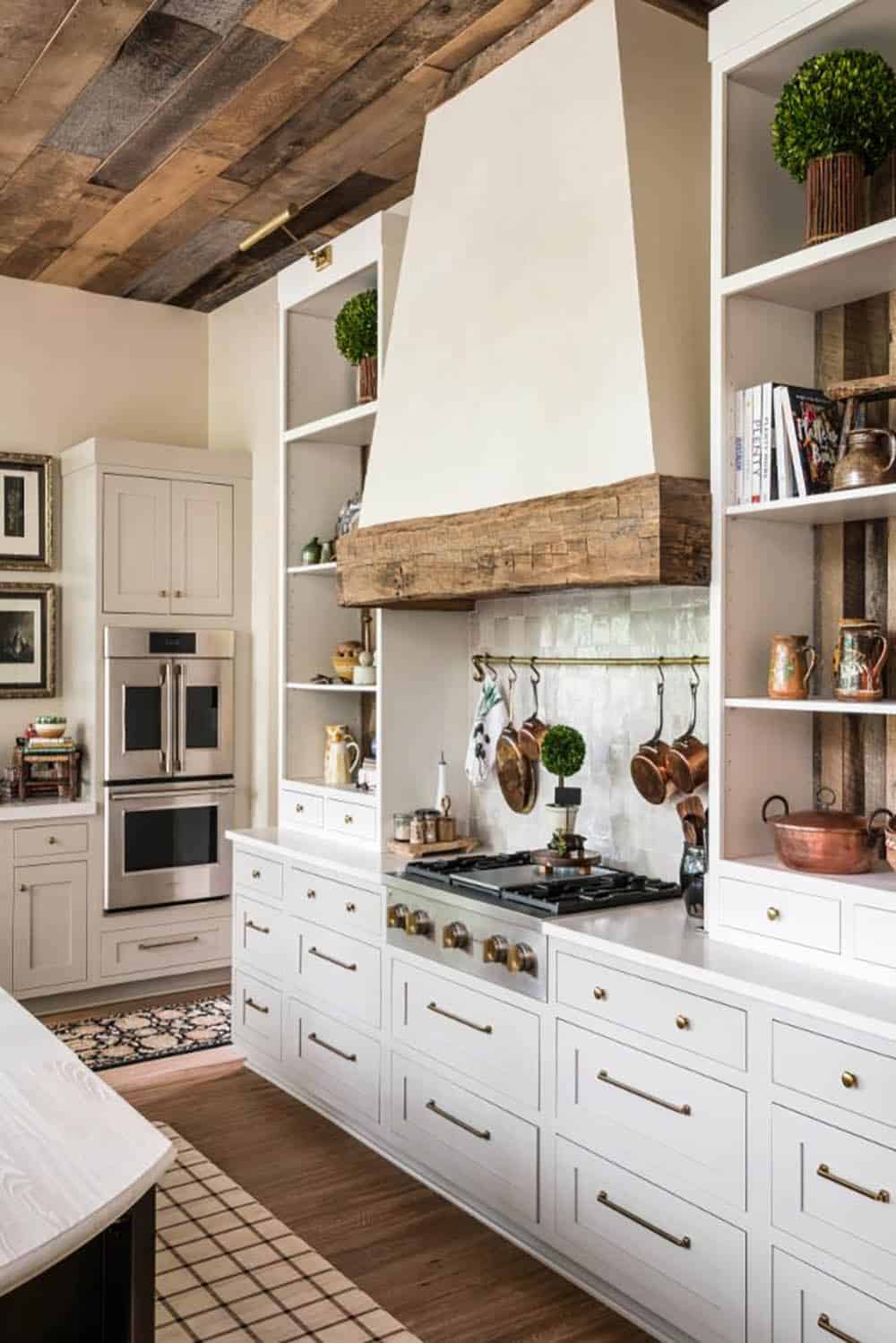 Kitchen range wall with plaster hood flanked by open shelving