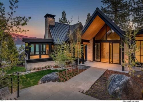 mountain modern lake house exterior at dusk